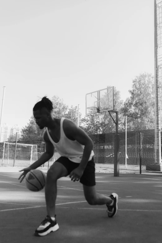 an image of a man playing basketball on court