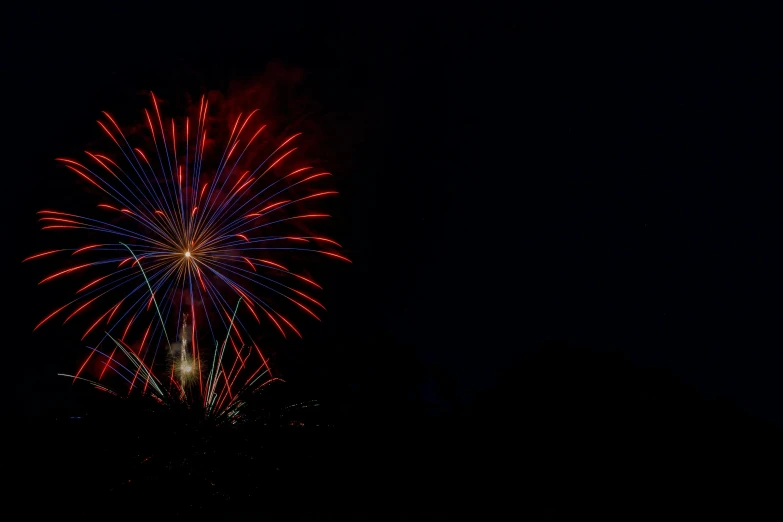 colorful fireworks are being displayed in the dark sky