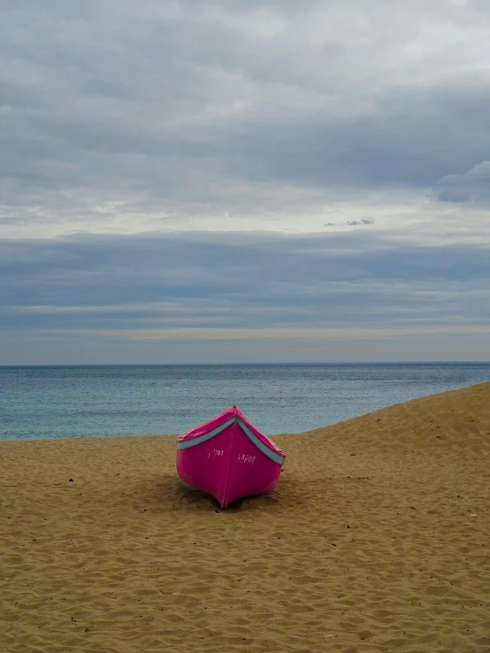 an umbrella on a beach in the sand