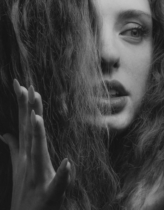 black and white pograph of woman with large hair