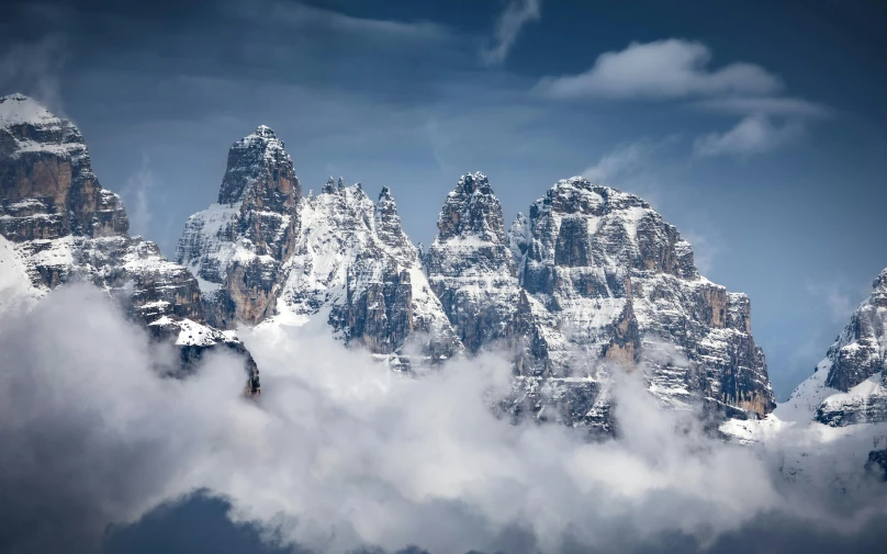 a few snow covered mountains are seen from a distance