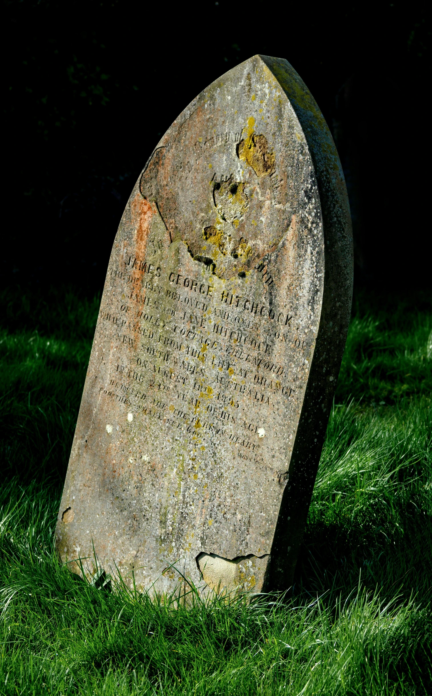 old stone with a hole and many writing on it