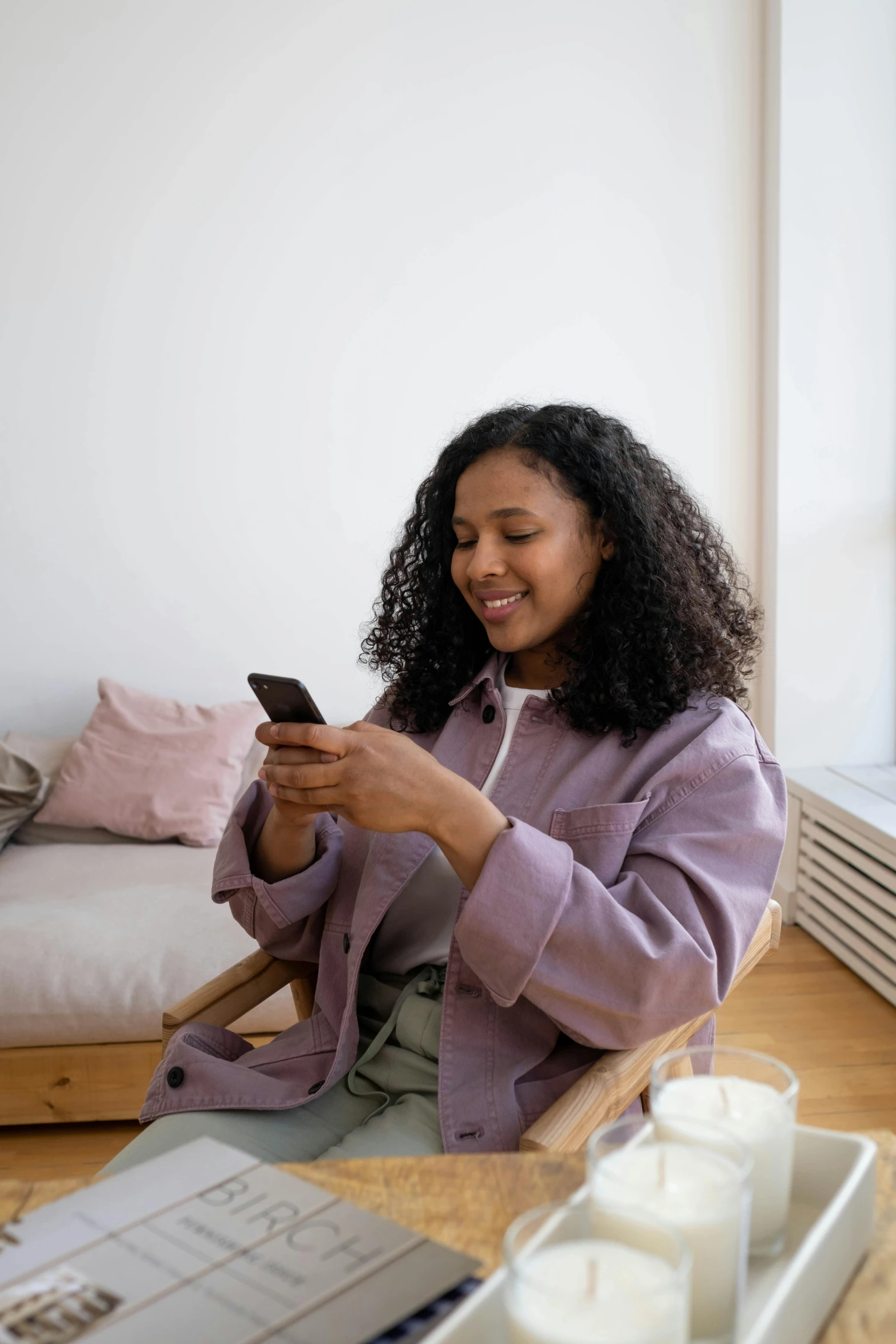 a woman looking at her cell phone