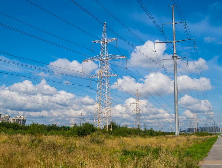 many power poles are next to a road