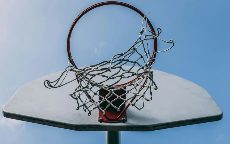 an empty basketball hoop with a metal rim