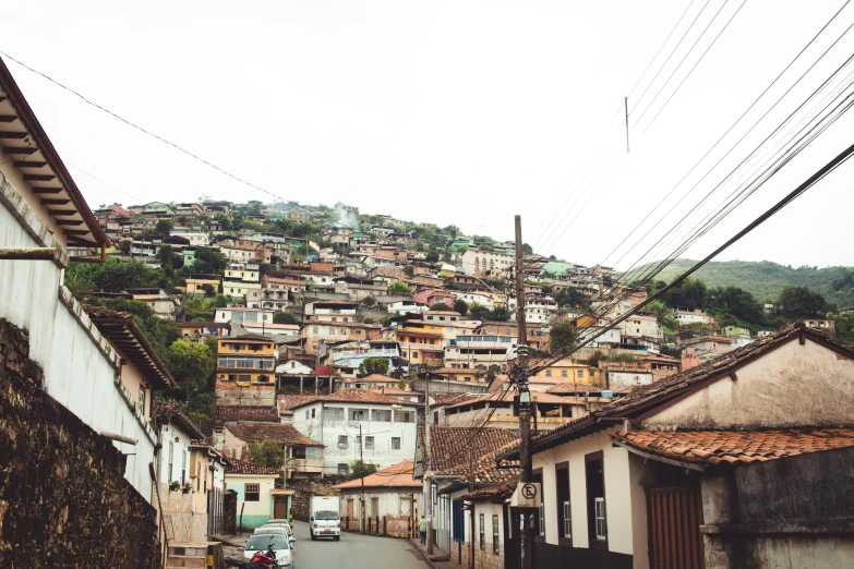 a street full of buildings and power lines