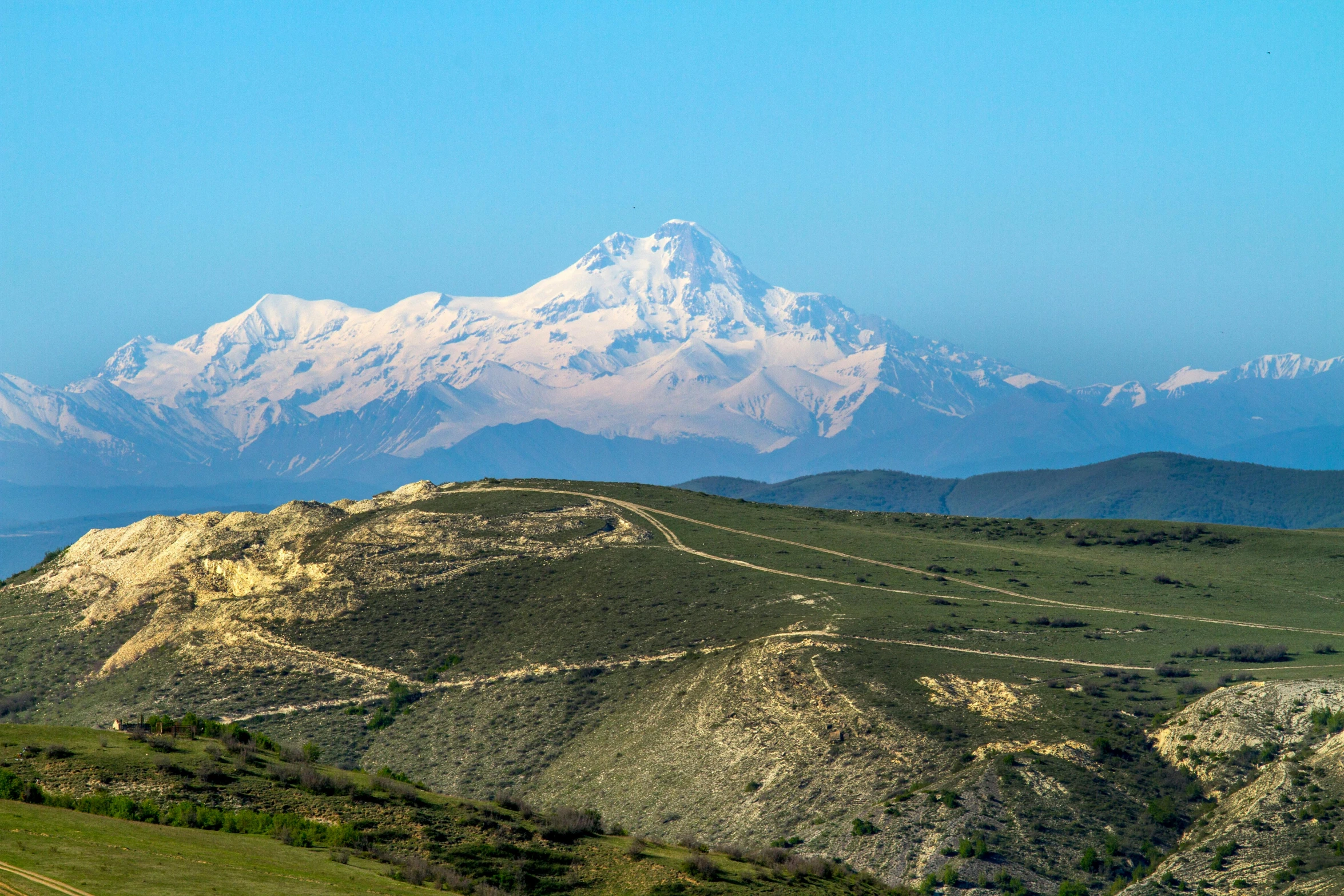 an image of snow capped mountain in the background