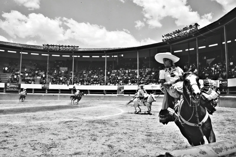 a man riding a horse in a rodeo competition