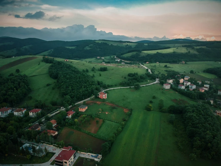 a green valley filled with lush green trees