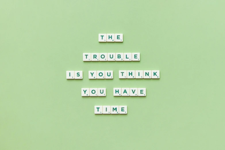 the words'the trouble is you think you have time'are made out of letters placed on top of them