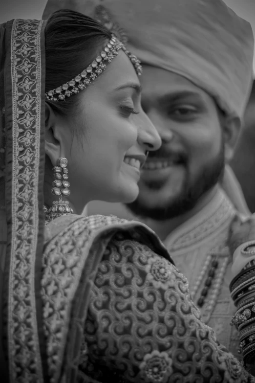 a black and white po of a bride wearing an elegant garb