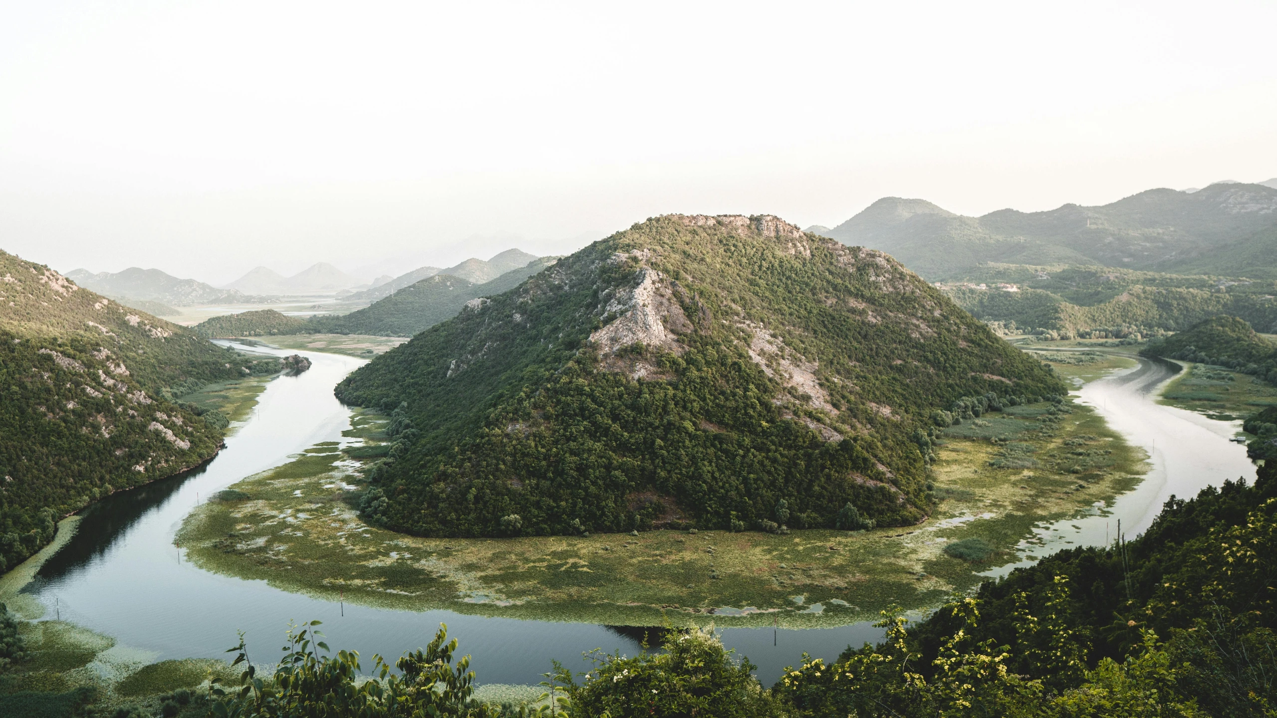 there are many mountains in this picture that looks like a giant island