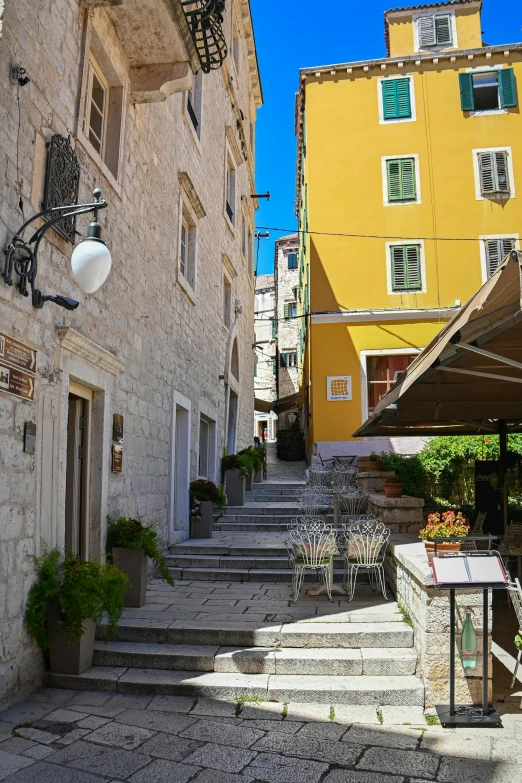 a stone building with stairs next to it