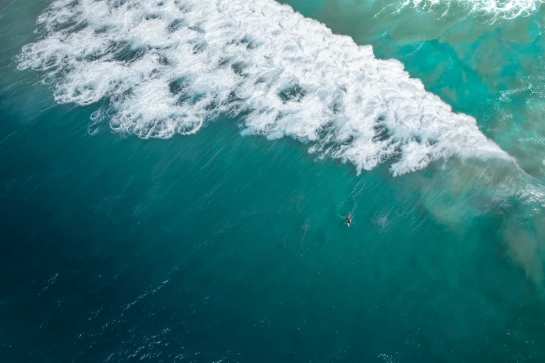 an aerial view of a large wave from the air