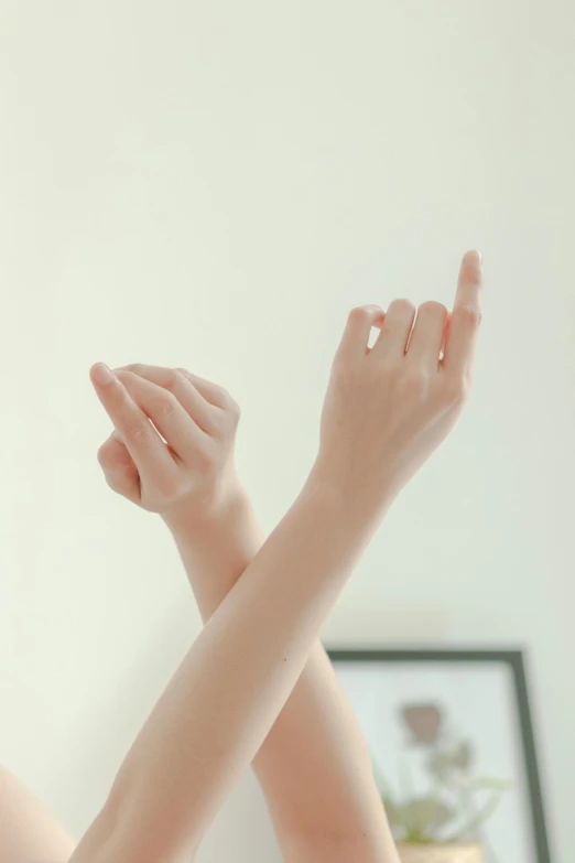 a woman with her hands over her face