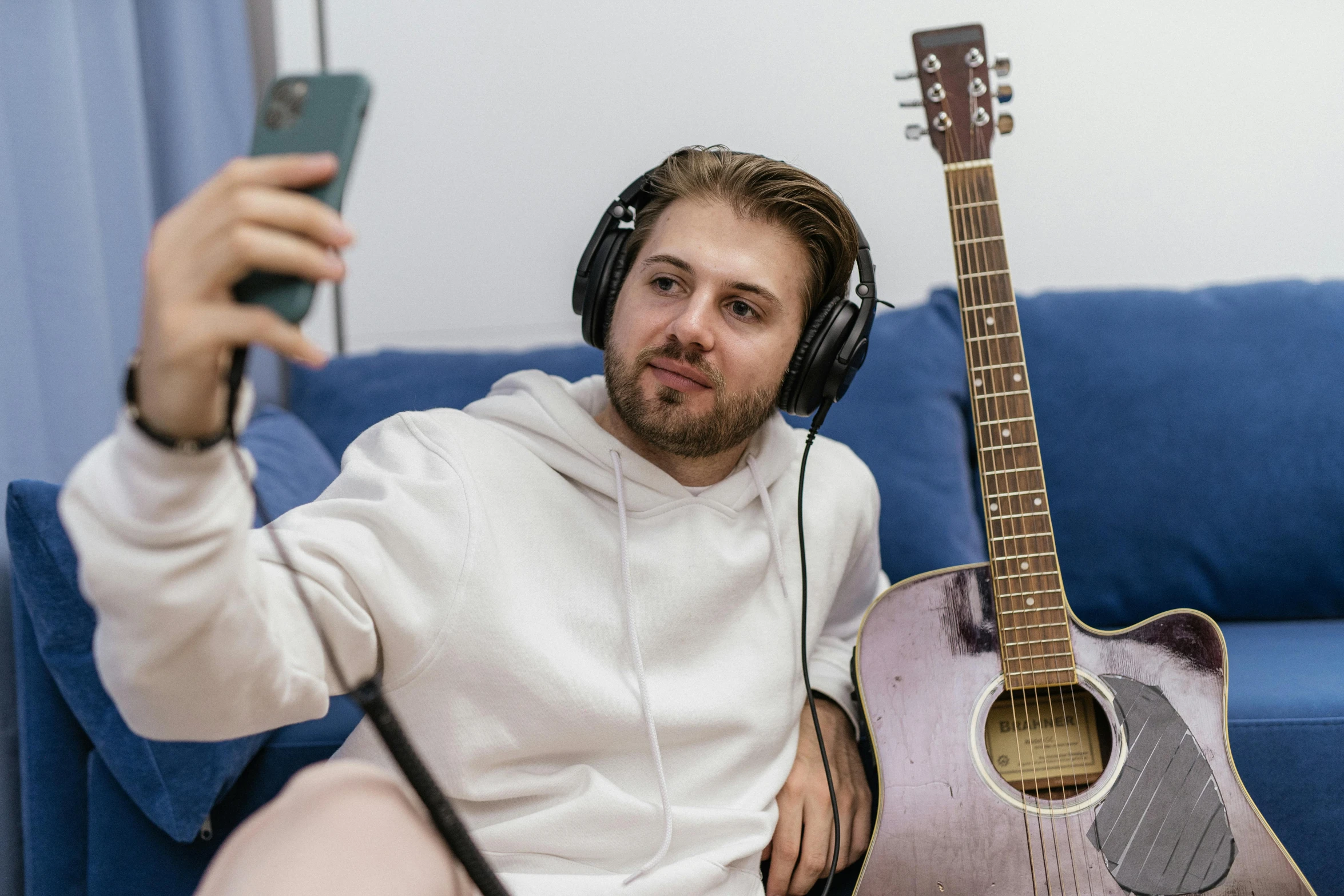 man with headphones and headbands playing on an instrument