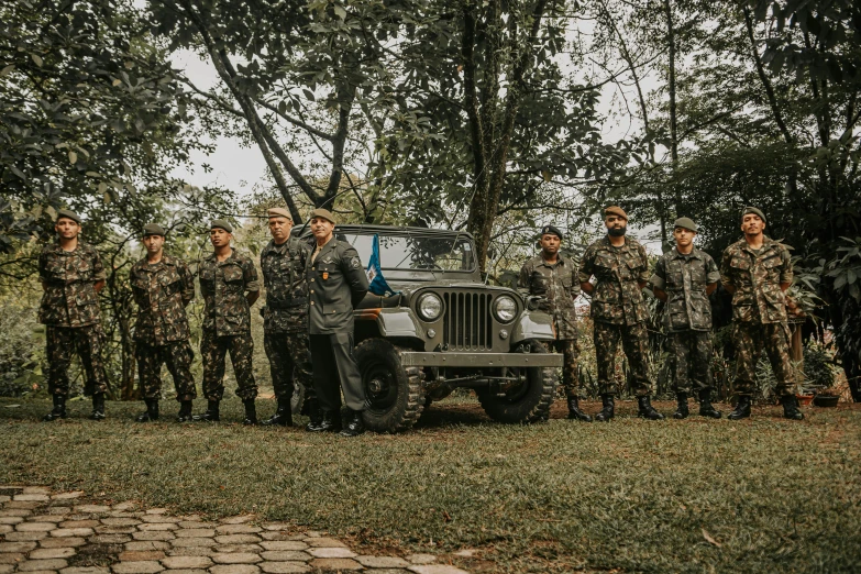 several soldiers are lined up to pose for a picture