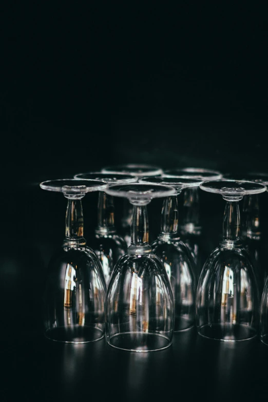 six wine glasses with gold rims lined up