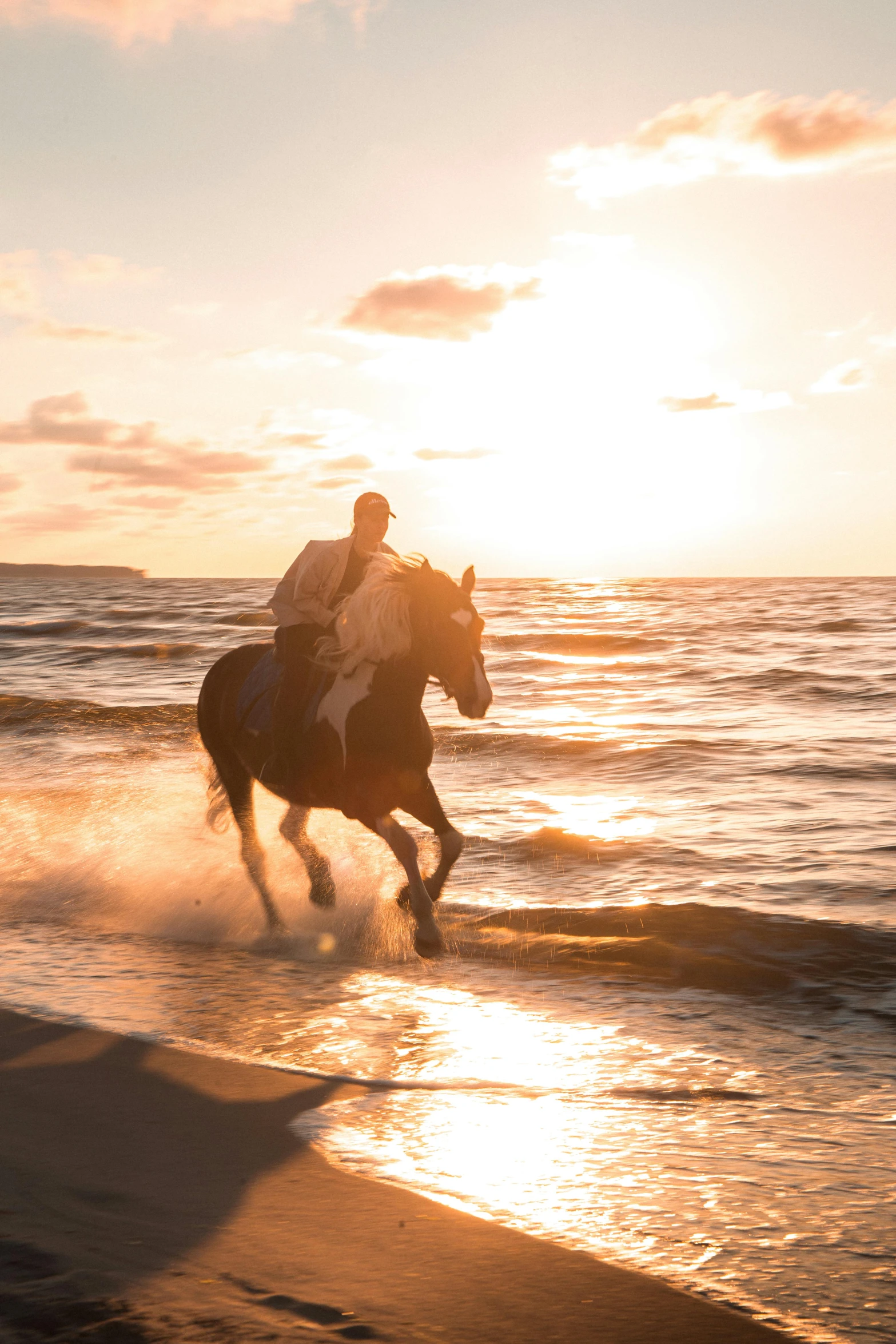 there is a man on a horse going through the water