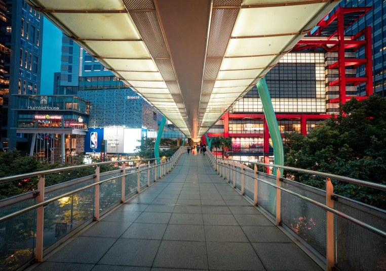 a walkway leads up into an area with lights