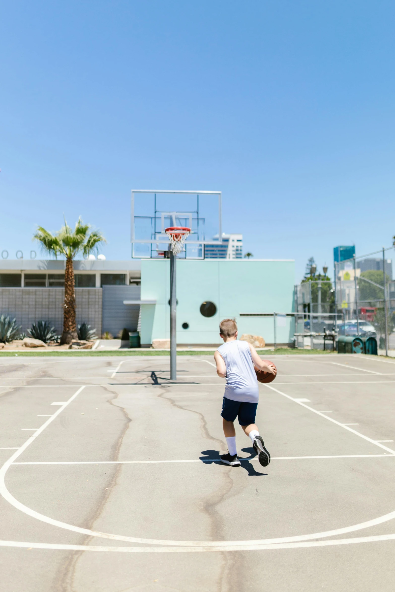 a  throwing a basketball into the air