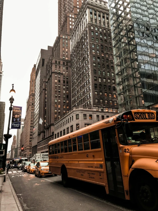 several vehicles on a city street with buildings