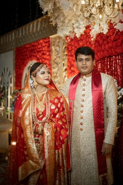 a bride and groom standing next to each other