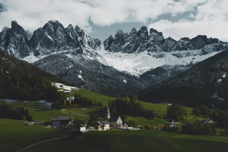 snowy mountains are near the village of flayo