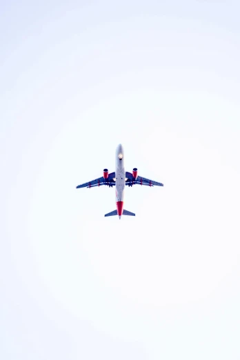an airplane in the sky in the daytime