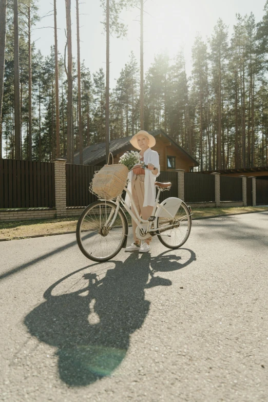 the woman is riding her bike with a basket