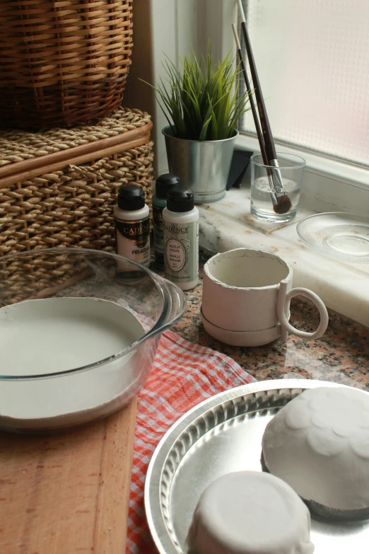 two plates sitting on top of a table covered with stuff