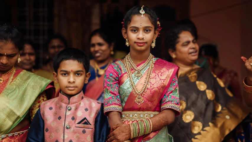 an image of young people that are dressed in traditional clothing