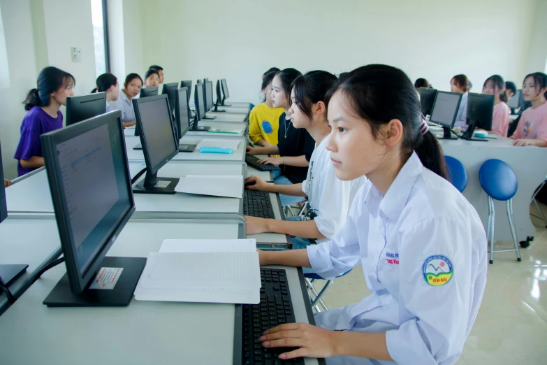 this is some women using computers in an office