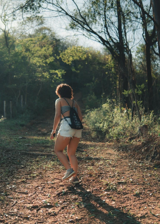 a person is standing near the trees