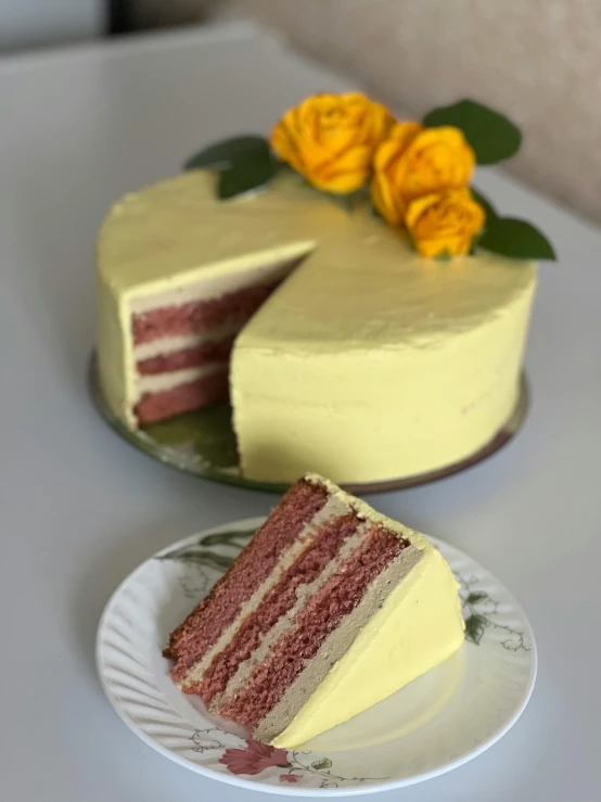 there is a slice of cake with yellow flowers on the plate