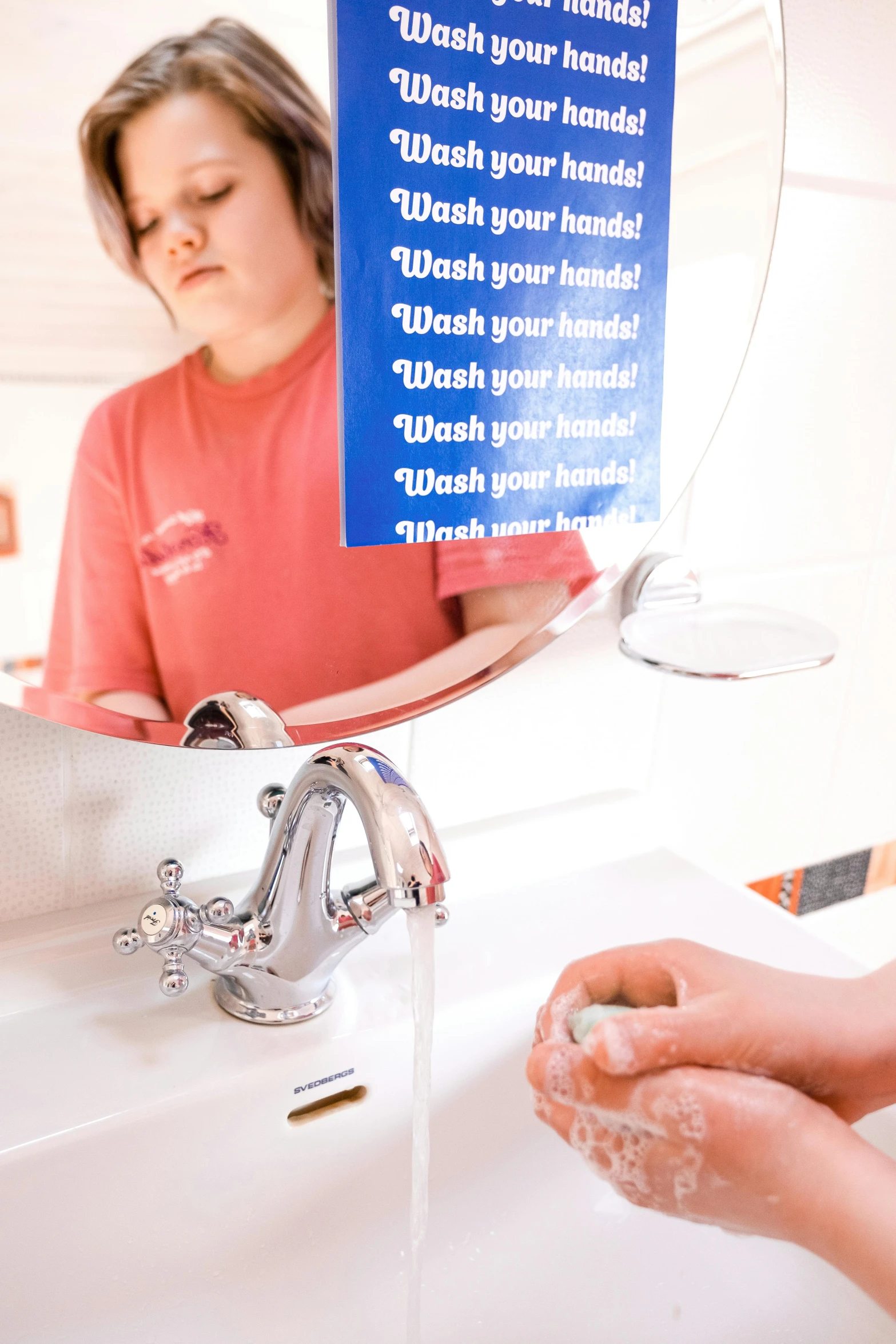 the  has her hands in the faucet