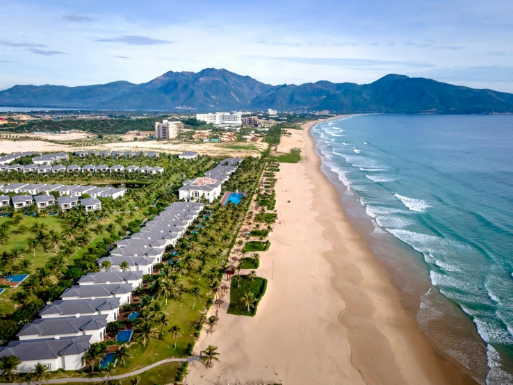 a beautiful sandy beach next to the ocean