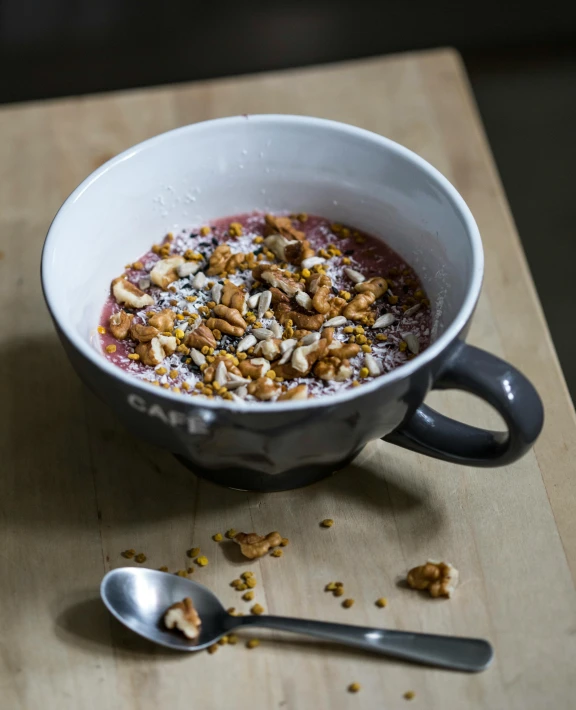 this is a bowl of granola on a table