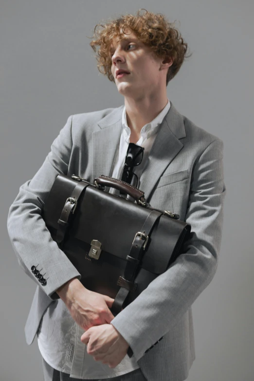 a man in a suit holding a briefcase