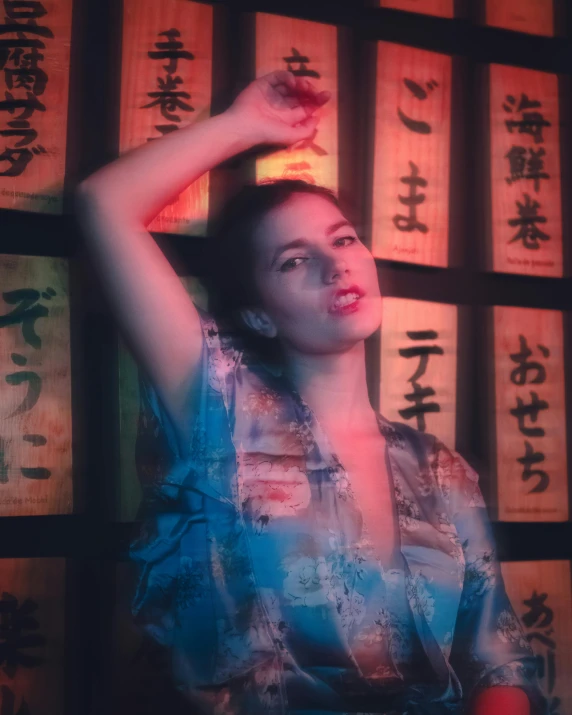 the girl stands near many lit up signs