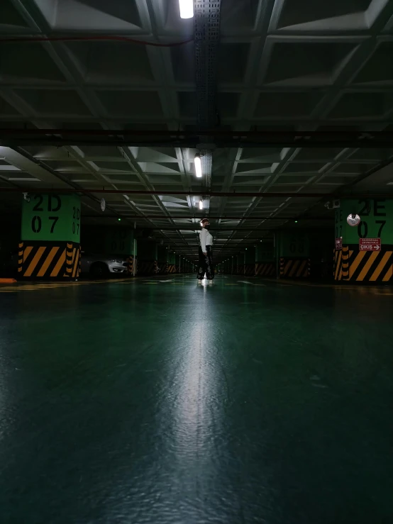 an empty warehouse with a person in it