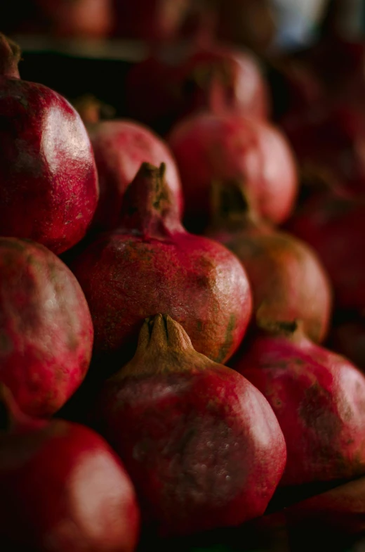 some very tasty looking pomegranates stacked on top of each other