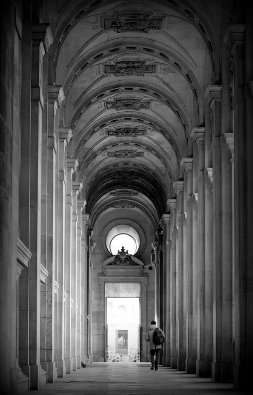 two men walk through the hallway of a building