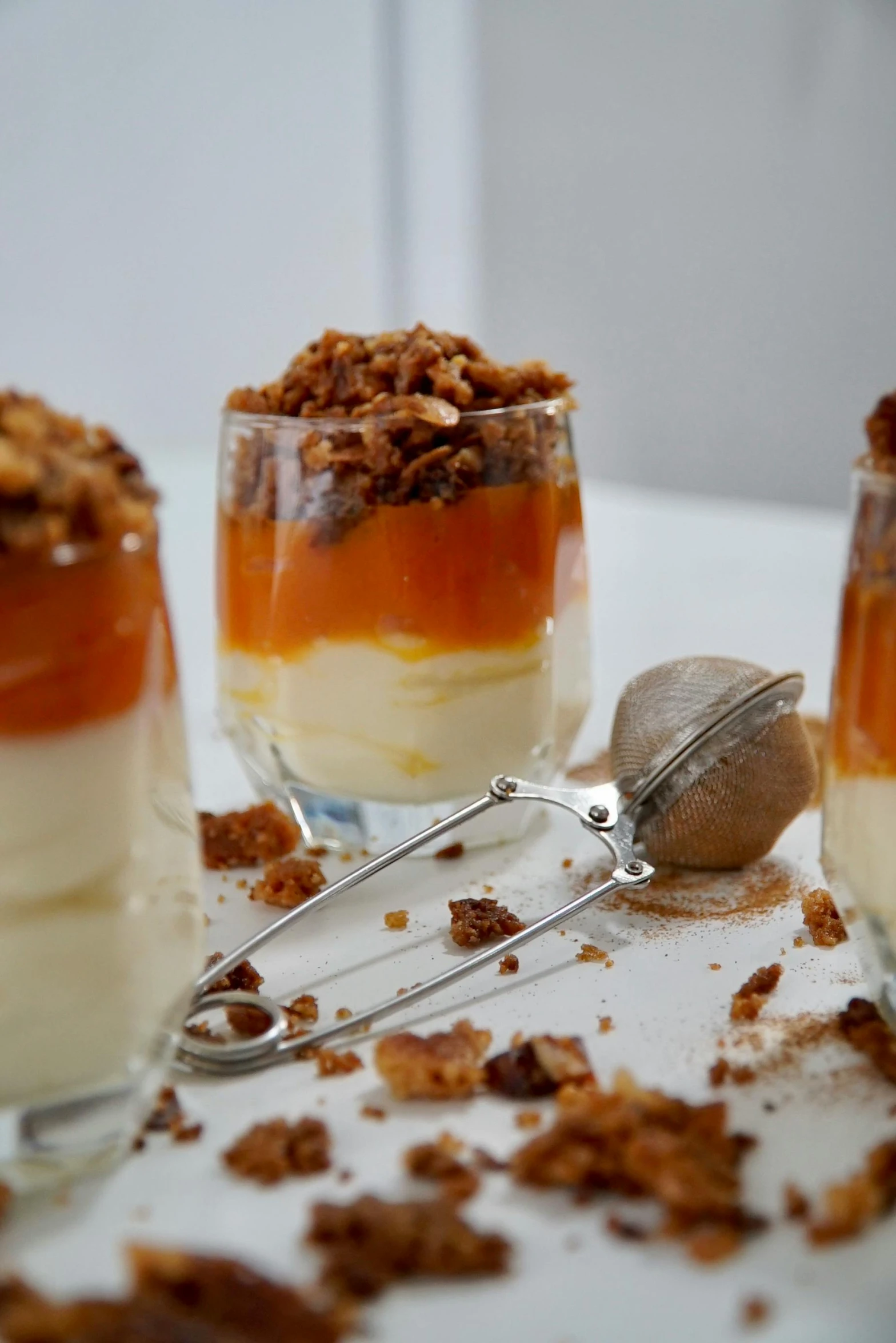 desserts and utensils on a table including cereal