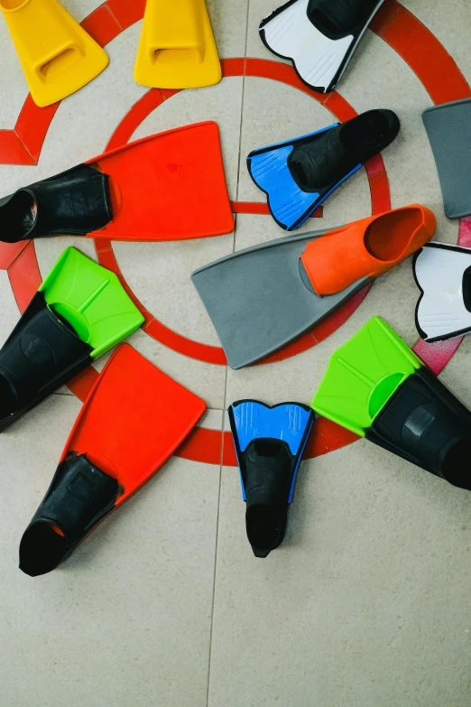 various colored rubber toys laid out on the floor