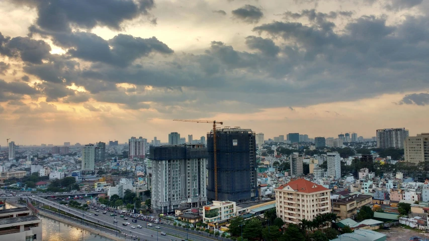 an overcast sky with the sun lighting up the horizon