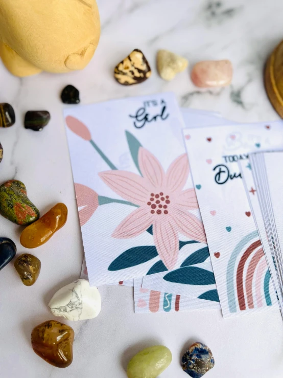 some small rocks and a card sitting on a table