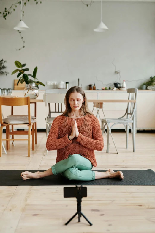 a woman in a yoga pose doing a meditation exercise