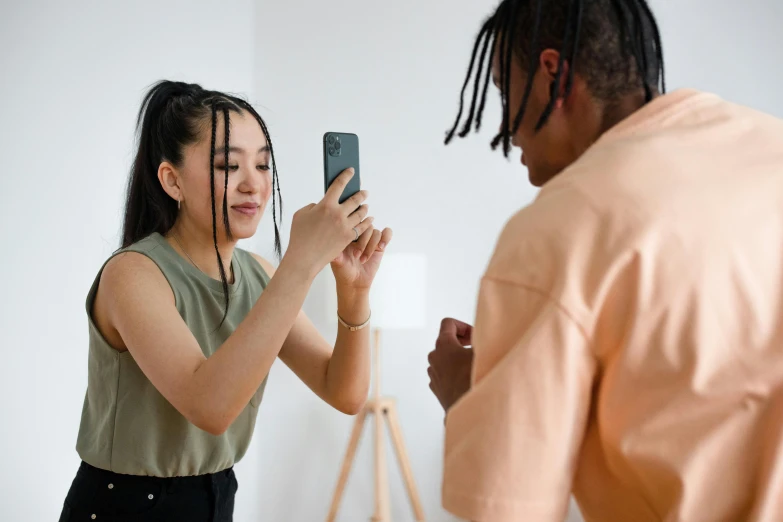 a man and woman are taking pictures together