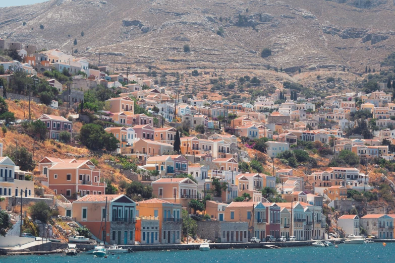 the town is painted orange and blue by the ocean